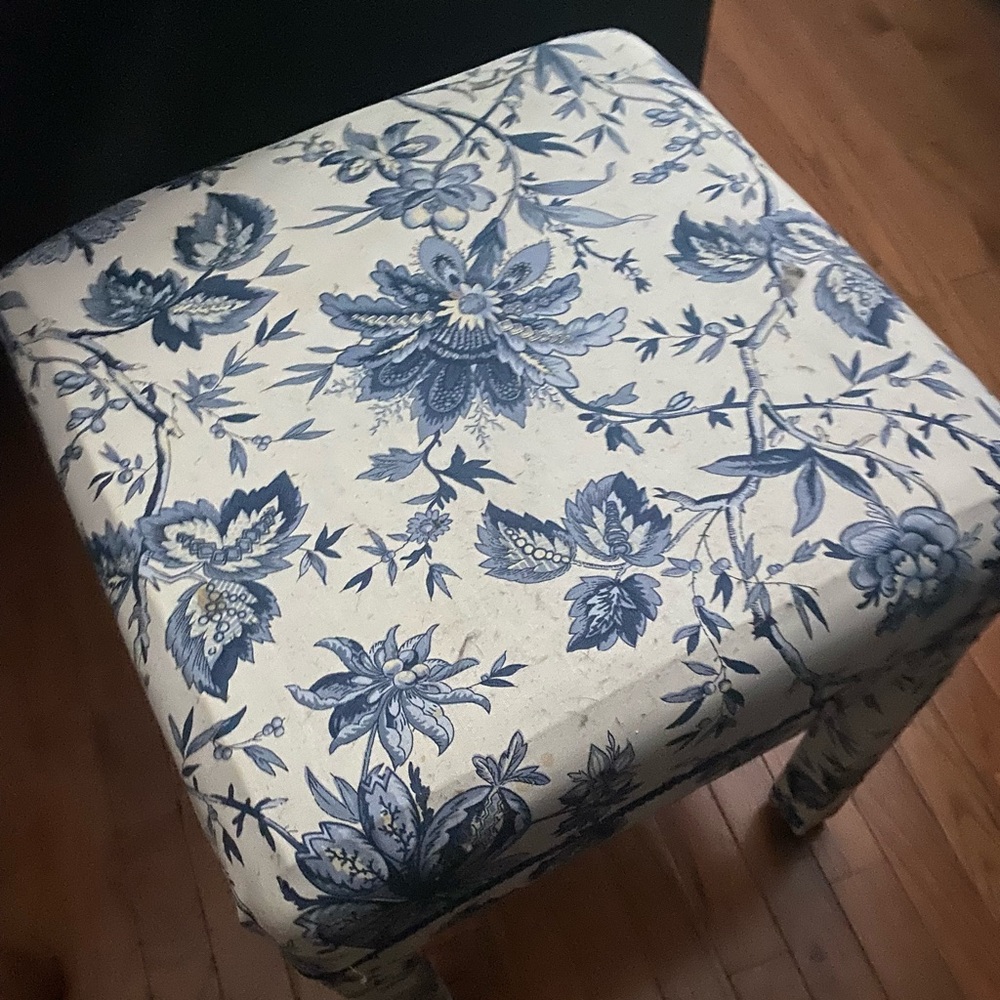 Blue and white sewing bench or foot stool. This can be used for various things.